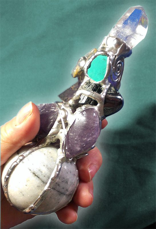 A person holding a small toy sword in their hand.