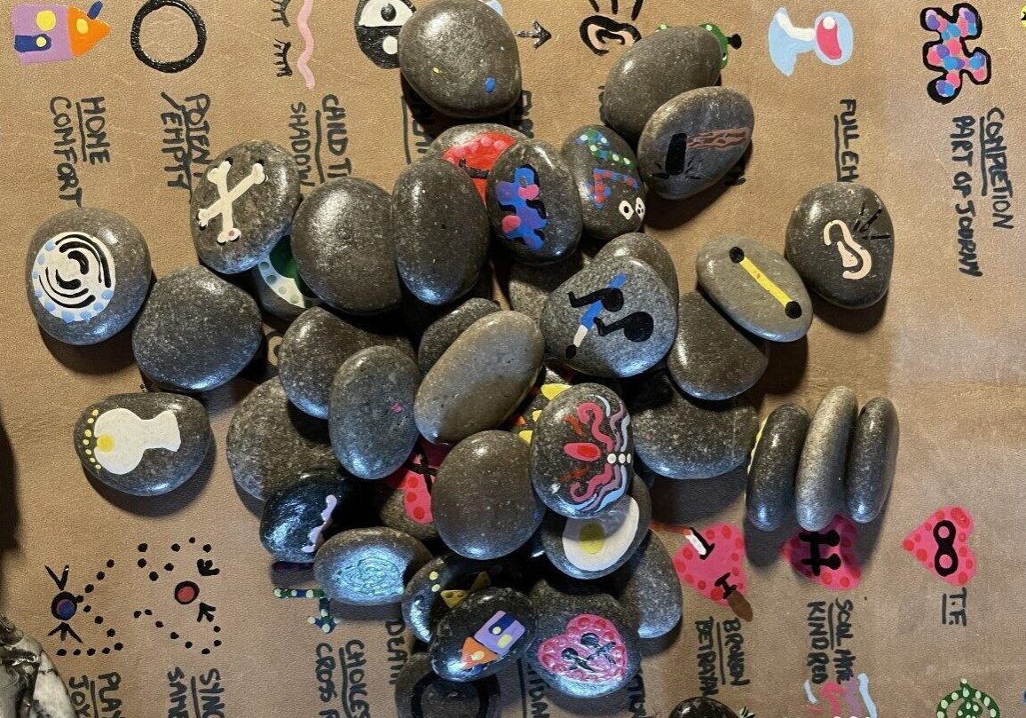 A bunch of rocks with different designs on them
